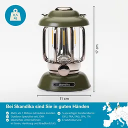 Grüne Laterne mit transparentem Glas und metallischen Details, Höhe 17 cm, Durchmesser 11 cm. Gewicht 0,5 kg.