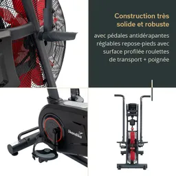 Rower mit robustem Design, Ruderblättern, roten Lüfterelementen und einer digitalen Anzeige. Pedale mit rutschfester Oberfläche.