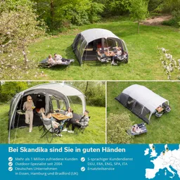 Familienzelte in einer grünen Wiese, Menschen sitzen am Tisch, ein Zelt im Hintergrund, Bäume und Blumen.