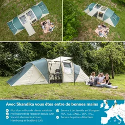 Zelt in grünen und beigen Tönen auf Wiese, mit Picknickdecke und vier Personen. Üppiges Grün im Hintergrund.