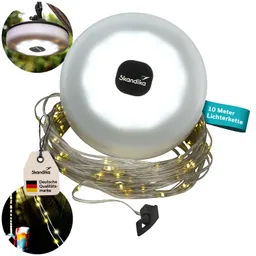 Verpackung einer Lichterkette mit einer silbernen Lampe, umgeben von einer schimmernden Lichterkette und einem Etikett.