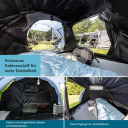 Zeltinnensicht mit schwarzem Kabinenstoff. Schlafsack und Kissen auf dem Boden, zwei Eingänge sichtbar. Außenbereich mit Bäumen und weiteren Zelten.