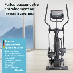 Elipsentrainer in einem hellen Raum mit großen Fenstern und einem Blick auf eine Berglandschaft. Textinformationen zu Qualität und Kundenservice.