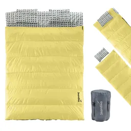 Gelbes Schlafsack-Modell mit weißem, gemustertem Innenfutter und grauer Tragetasche. Zwei separate Einklappkissen sind enthalten.