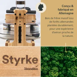 Rudergerät aus massivem Eschenholz mit Wasserbehälter, beschriftet mit „Styrke“ und Informationen zu nachhaltiger Produktion.