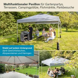 Multifunktionaler Pavillon mit Tisch und Stühlen, umgeben von Rasen und Bäumen. Griller auf der linken Seite.