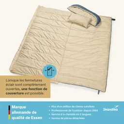 Beige Schlafsack mit Kissen auf hellem Hintergrund. Text über Funktion und Kundenservice am unteren Bildrand.