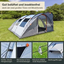 Zelt mit zwei großen Türen und Moskitonetzen, auf einer Wiese. Fenster und Türen sind mit Verdunkelungen ausgestattet.