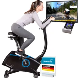Eine Person sitzt auf einem Hometrainer. Neben dem Gerät ist ein Bildschirm mit einer Fahrradroute im Freien.