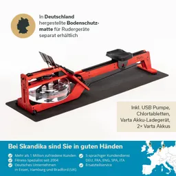 Rudergerät in roter Farbe auf einer schwarzen Bodenschutzmatte, mit Zubehör wie USB-Pumpe und Akkus dargestellt.