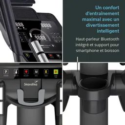 Das Bild zeigt ein Fitnessgerät mit einem Bedienfeld. Es sind Tasten für Programm, Körperfett, Wiederherstellung, Modus und Reset sichtbar. Zudem gibt es eine Halterung für ein Smartphone und einen Getränkehalter.