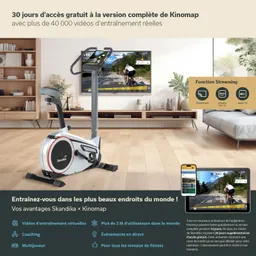 Ein Ergometer steht im Wohnzimmer, davor ein Fernseher mit Trainingsvideo. Neben dem Ergometer ein Tablet mit App-Details.