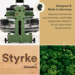 Rudergerät aus grünem Holz mit transparentem Wassertank, Holzoberfläche mit dem Schriftzug "Styrke" und Naturansicht.