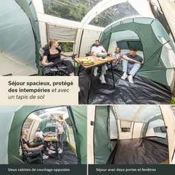 Großes Zeltinnere mit mehreren Personen, einem Tisch mit Essen und zwei Schlafkabinen. Grüne Zeltwände und Bodenbelag sichtbar.