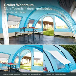 Zeltinnere mit blauen Wänden, einem Tisch und Stühlen. Große Fenster und Türen sind sichtbar. Tageslicht strömt herein.