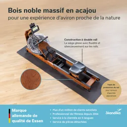 Rudergerät aus massivem Mahagoniholz mit ergonomischem Sitz, auf einer Matte platziert. Textinformationen in Französisch.