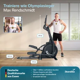 Ellenbogentrainer in einem Zimmer mit großen Fenstern. Person steht neben dem Gerät. Text und Maßangaben sind eingeblendet.
