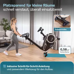 Ein Fitnessgerät, ein Ergometer, steht im Vordergrund. Daneben steht eine Person mit einem schwarzen T-Shirt und Shorts und lächelt.