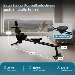 Rudergerät mit Doppellaufschiene, Maßen und maximaler Belastung. Im Hintergrund Fenster mit Aussicht auf Landschaft.