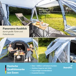 Zelt mit großen Fenstern und Türen im Freien, Möbel und Getränke auf einem Tisch, grüne Wiese im Hintergrund.