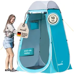 Pop-Up-Zelt in Blau und Grau mit einer Person, die eine Etikette anfasst. Zelt steht auf geradem Boden, innen hell.
