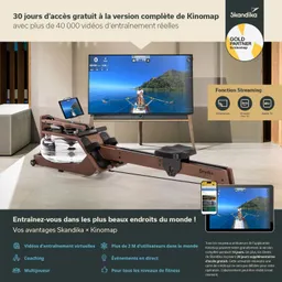 Rudergerät aus Holz mit Wasserbehälter steht vor einem Fernseher, der eine Ruder-Szene zeigt. Tablet und Smartphone sind sichtbar.