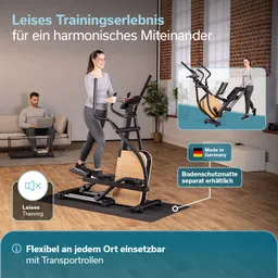 Person trainiert auf einem Ellipsen-Trainer in einem modernen Raum. Im Hintergrund sitzt eine weitere Person auf einer Couch am Laptop.