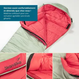 Schlafsack in zwei Farben: außen hellgrün, innen korallrot. Details der Innenpolsterung und Markenlogo sind sichtbar.