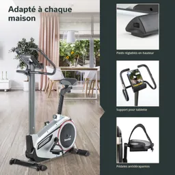 Heimtrainer in einem modernen Raum, mit großen Fenstern und einer grünen Pflanze. Elemente wie ein Tablet-Halter und rutschfeste Pedale sind gut sichtbar.