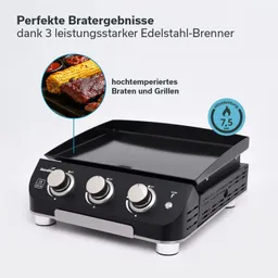 Grillplatte mit drei Drehknöpfen und Edelstahloberfläche. Im Hintergrund gegrilltes Fleisch und Mais. Heizleistung 7,5 kW.