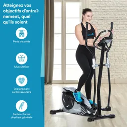 Eine Person steht auf einem Ellipsentrainer in einem hellen Raum mit Fenstern. Der Trainer ist schwarz und silber.