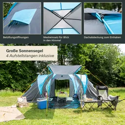 Zelt mit blauen und grauen Elementen auf einer Wiese. Vor dem Zelt stehen zwei Stühle und ein Tisch. Hintergrund zeigt Bäume.