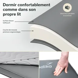 Matratze mit grauem Bezug und ergonomischer Schaumstoffschicht. Detailansicht der Oberfläche und Logo.