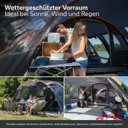 Ein wettergeschützter Vorraum mit Personen, die eine Küche einrichten. Im Hintergrund Zelt und Wasser. Ein Tisch mit Stühlen und Getränken.