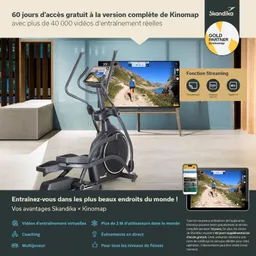 Ein Ellipsentrainer steht im Vordergrund, davor ein Fernseher mit einer Sporttrainingsanwendung. Auf dem Bildschirm ist eine Landschaftsaufnahme zu sehen.
