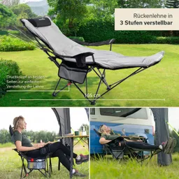 Faltliege mit verstellbarer Rückenlehne, auf einer Wiese. Neben der Liege sitzt eine Person in einem Stuhl.