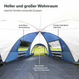 Geräumiges Zeltinnere mit blauen und weißen Wänden, Fenster sowie einem geschützten Eingangsbereich.