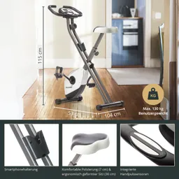 Faltbares Ergometer mit Smartphonehalterung, ergonomischem Sitz und Handpulssensoren. Maße: 115 cm hoch, 104 cm lang.
