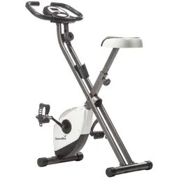 Faltbares Ergometer mit einem Sitzpolster, einem Lenker und Pedalen. Die Konstruktion ist in Grau und Weiß gehalten.