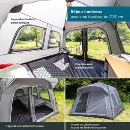 Geräumiges Zeltinnere mit großen Fenstern, zwei Türen, einem Tisch und einem Bett. Außenzelt im Hintergrund.