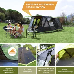 Zelt auf einer Wiese mit vier Personen, die an einem Tisch sitzen, umgeben von Bäumen und Wiese.