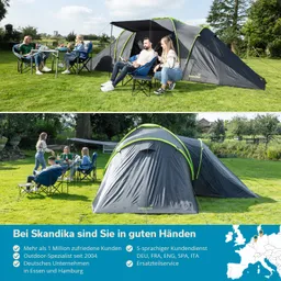 Mehrere Personen sitzen um einen Tisch auf Rasen, neben einem aufgestellten Zelt. Ein paar Bäume und ein Haus sind im Hintergrund sichtbar.