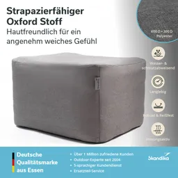 Grauer quadratischer Hocker aus strapazierfähigem Oxford-Stoff, neben Textinformationen über Eigenschaften und Marke.