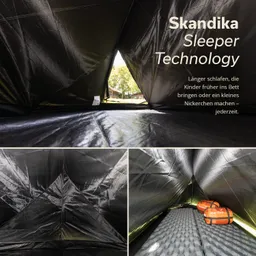 Schwarzes Zeltinnere mit Sicht auf das Außengelände. Auf dem Boden liegt eine Isomatte, daneben zwei orangefarbene Packsäcke.