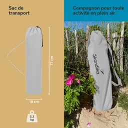 Grauer Transportbeutel mit einem Maß von 77 cm und 18 cm, beschriftet mit „Skandika“, vor einer grünen Umgebung.