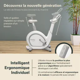 Fitnessbike in modernem Design. Höhenverstellbarer Sattel und Lenker. Pflanze im Hintergrund, neutraler Raum.