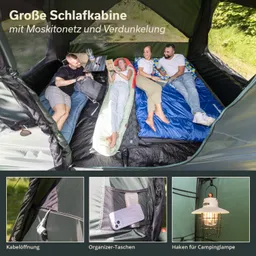 Schlafkabine mit vier Liegen, umgeben von Moskitonetz. Deko-Elemente wie Organizer-Taschen, Kabelöffnung und Lampenaufhängung sichtbar.