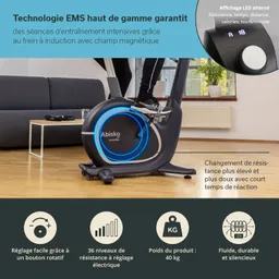 Fitnessgerät mit blauem Leuchtkreis, der von einer Person genutzt wird. Im Hintergrund ein Sofa und ein Tisch.