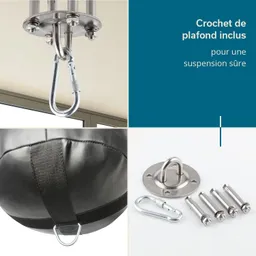 Auf dem Bild sind ein Deckenhaken, ein Boxsack und Montagematerial abgebildet. Der Haken hängt von der Decke, der Boxsack hat ein Befestigungsband und daneben liegt eine Platte mit Schrauben.