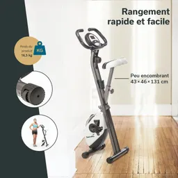 Faltbares Fitnessgerät mit Lenker und Sitz. Gewicht 16,5 kg, kompakte Maße 43×46×131 cm. Holzfußboden im Hintergrund.